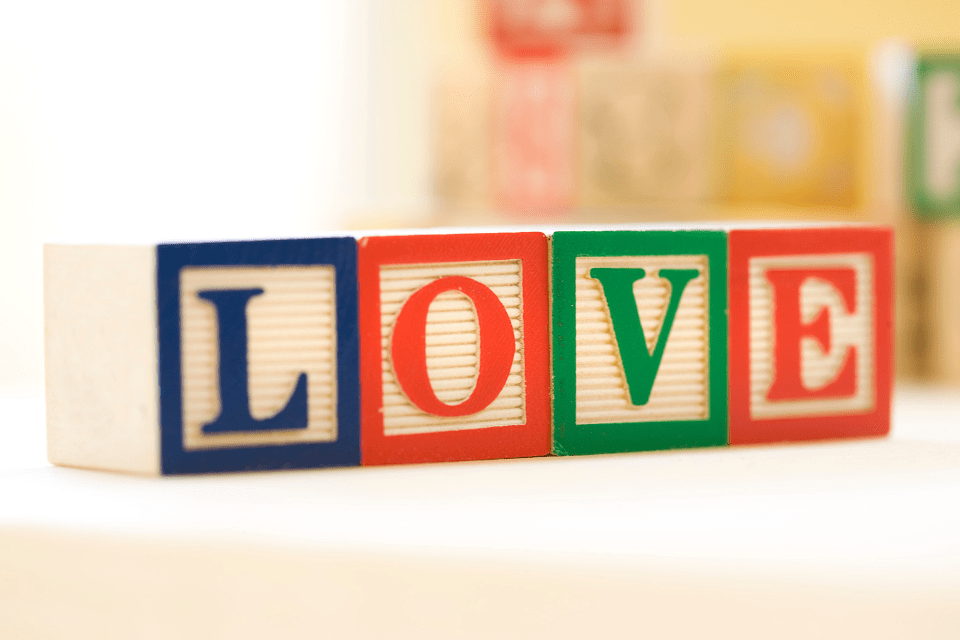 Different Colored Blocks Forming the Word Love - Building Blocks to True Love - Blossoms Dating Blog