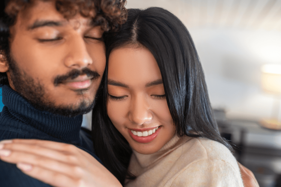 Multi-racial Filipina Wife Hugging Her Husband - What Makes a Filipina Attractive - Blossoms Dating Blog