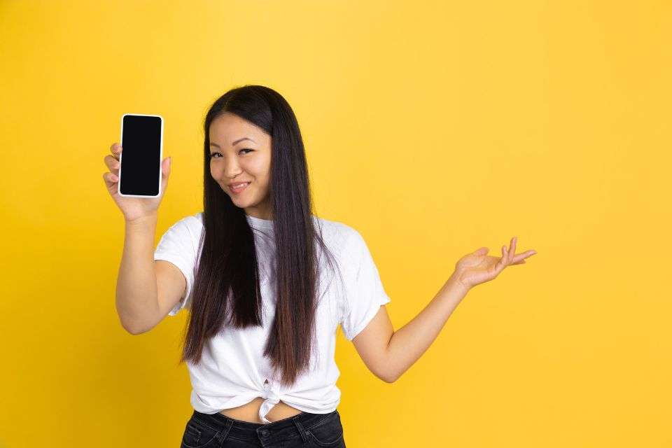 Filipina Showing Off Her Phone - She Wants You Move the Conversation Off the Dating Site - How to Spot a Filipina Scammer - Blossoms Dating Blog