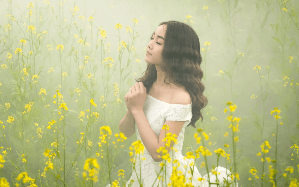 Filipino Woman in a Field of Yellow Flowers