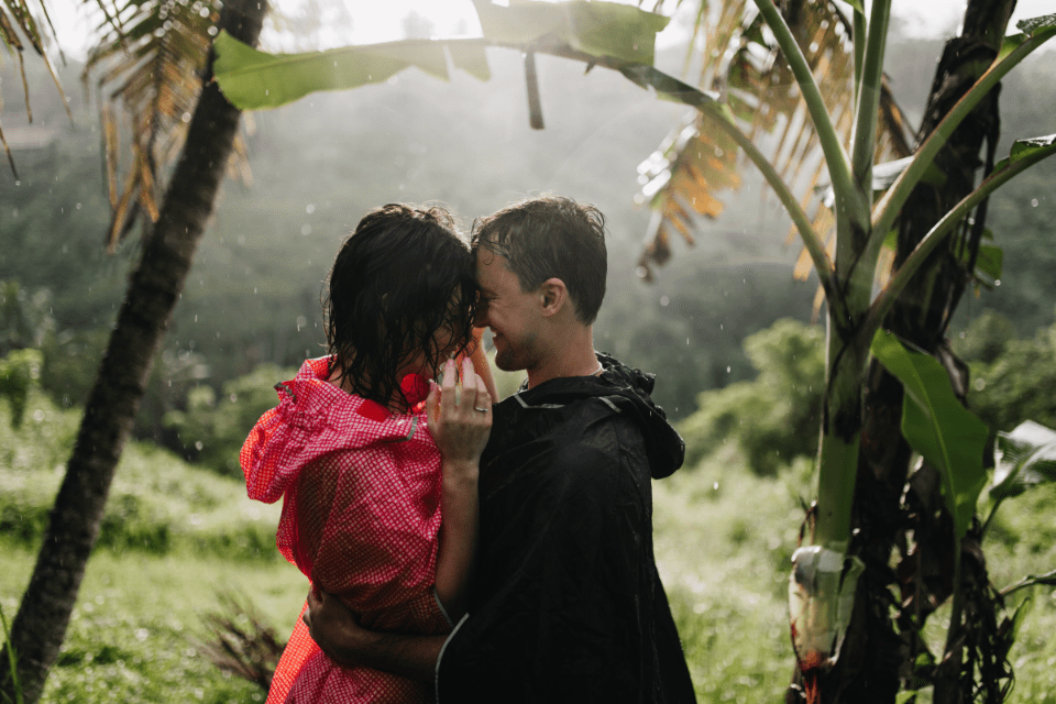 Young Couple Embracing in the Rainforest 