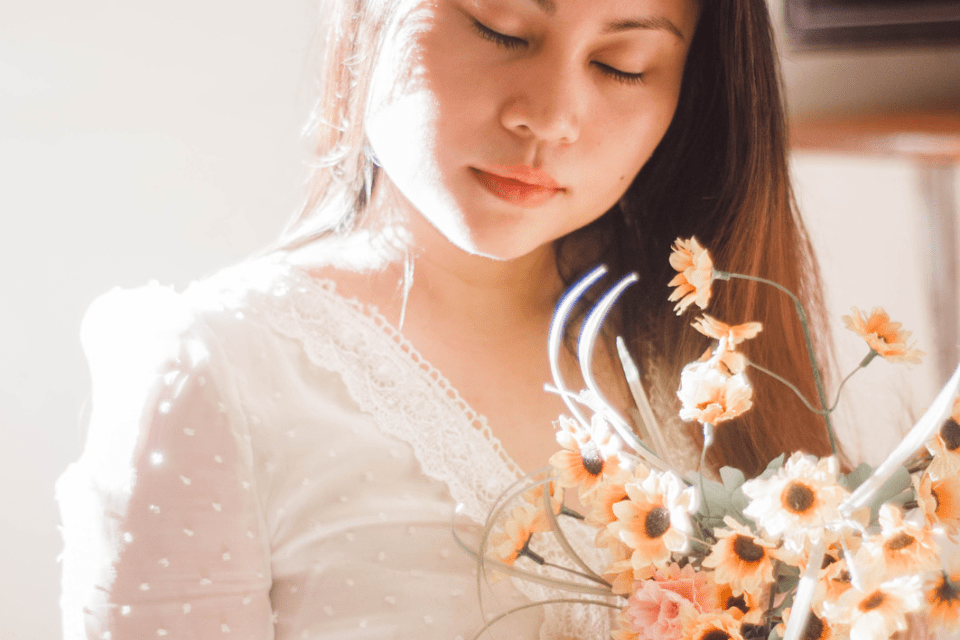 Grateful Filipina Woman with Flowers