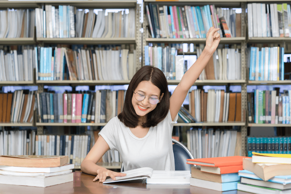 Young Filipina Woman Studying Successfully at the Library