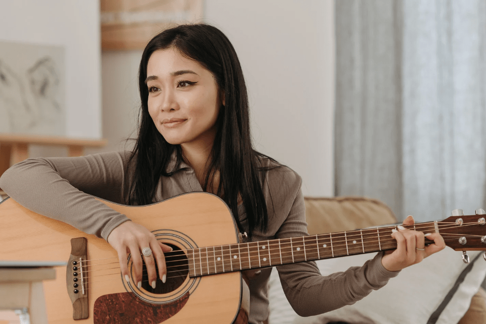 Attractive Filipina Girlfriend Strumming Her Guitar