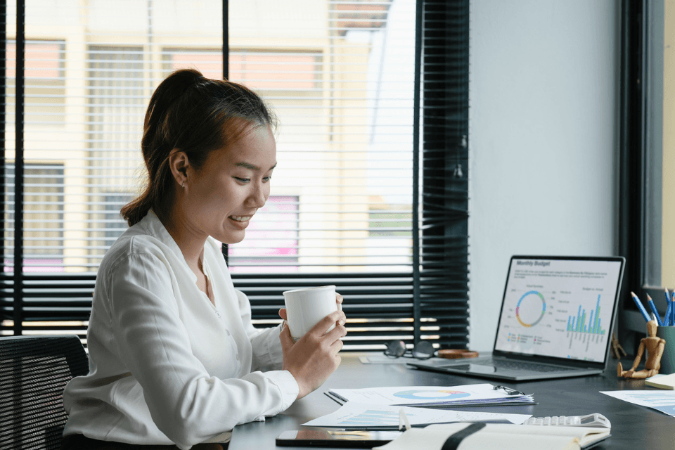 Filipino Business Accountant Going Over Financial Reports