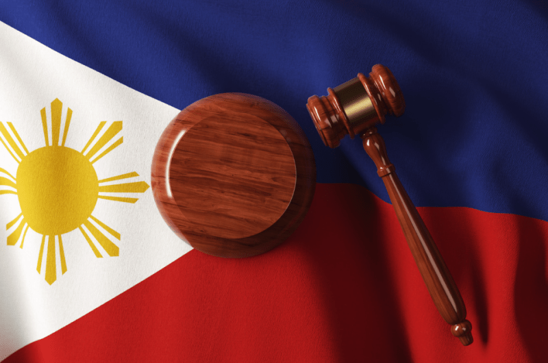 Wooden Gavel on Philippine Flag - Simple Guide to Philippine Dating Laws - Blossoms Dating Blog