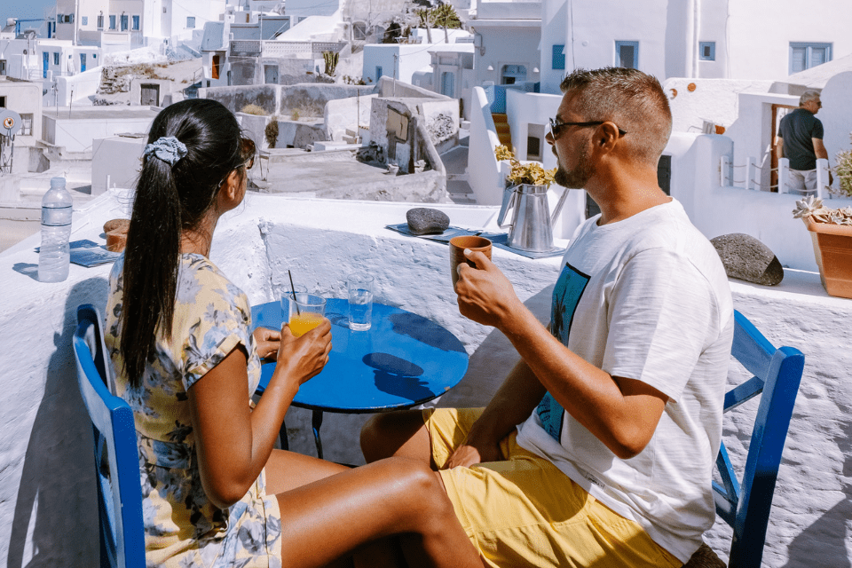 Intrracial Couple having Drinks in Santorini Greece