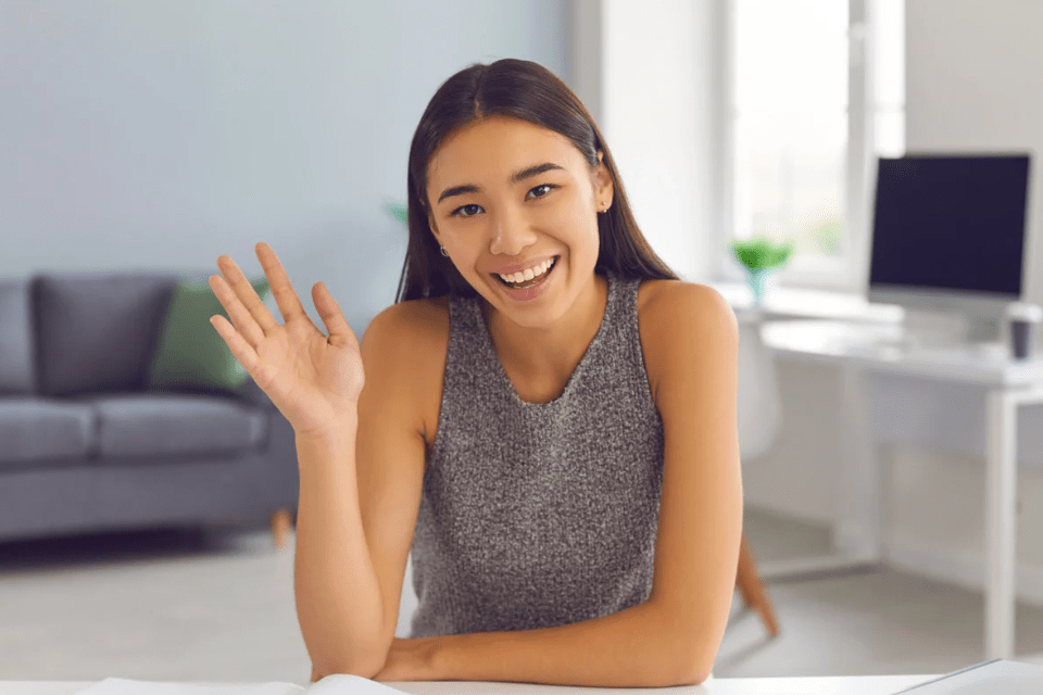 Young and Vibrant Filipino Woman Waving