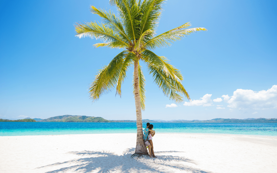 A couple on a romantic beach in Coron, Palawan, Philippines
