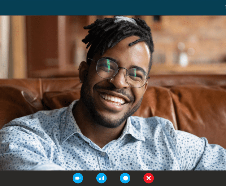 Smiling handsome African American man on a video call.